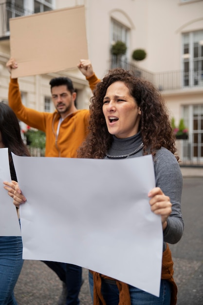 Close up people holding placards