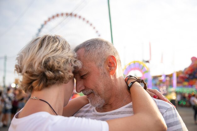 Close-up people in love hugging