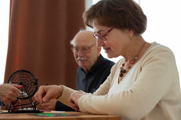 Close up people playing bingo together