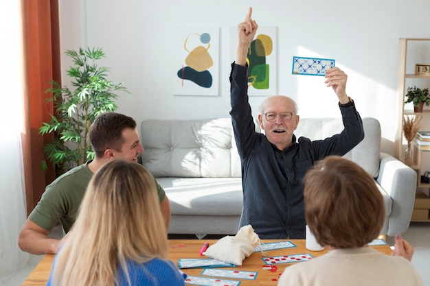 Close up people playing bingo together