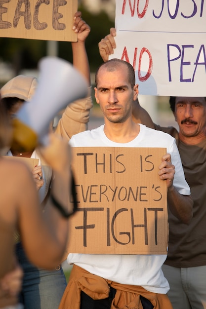 Close up people protesting together
