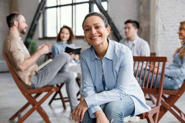 Close up people sitting on chairs