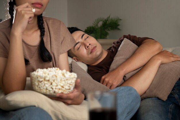 Close up people sitting on couch