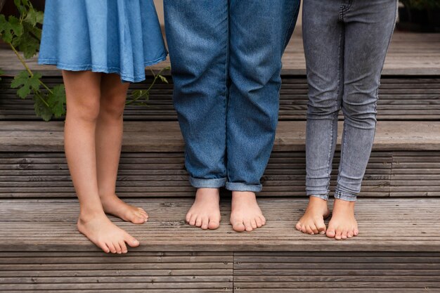 Close up people standing barefoot on stairs