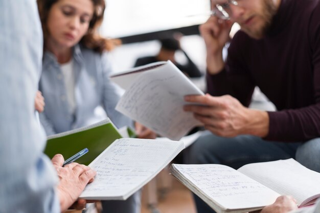 Close up people studying together