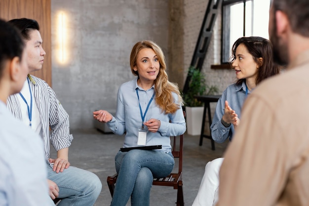 Close up people in therapy meeting