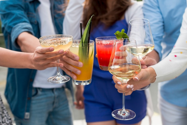 Close-up of people toasting at a party