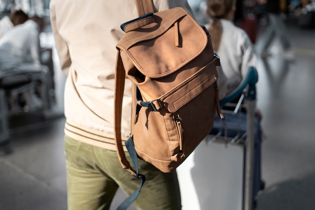 Free photo close up people traveling with baggage