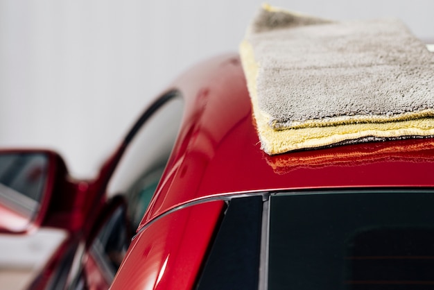 Close up of person cleaning car exterior