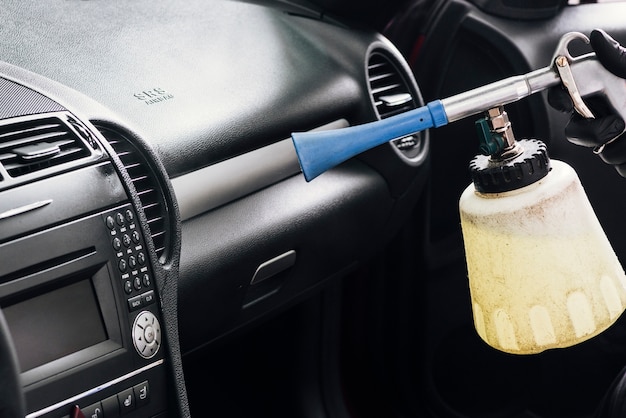 Free photo close up of person cleaning car interior