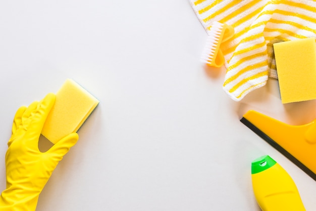 Free photo close-up person cleaning surface with sponge