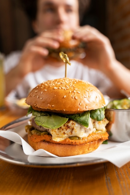 Free photo close up on person enjoying food