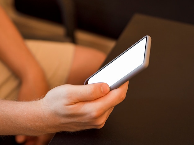 Close-up person holding phone mock-up