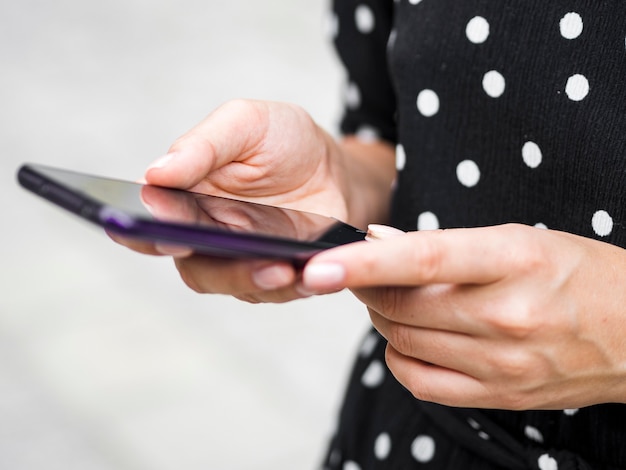 Close-up person holding smartphone