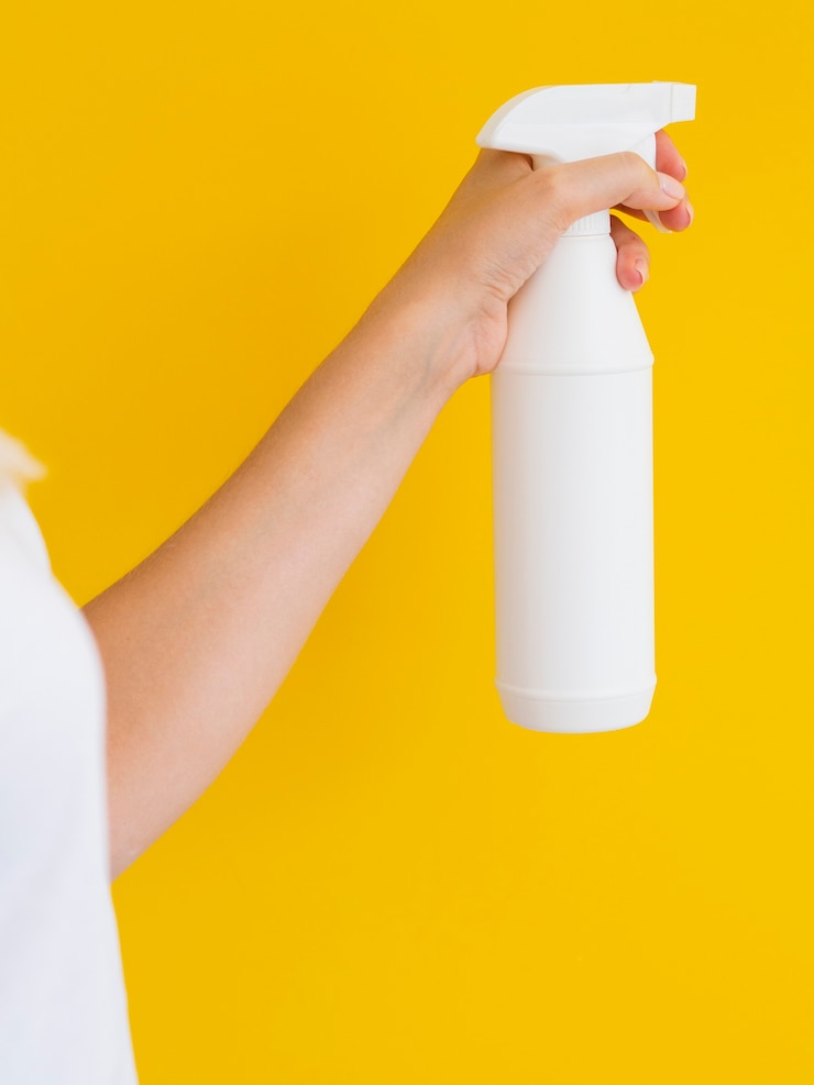 Free Photo close-up person holding up spray