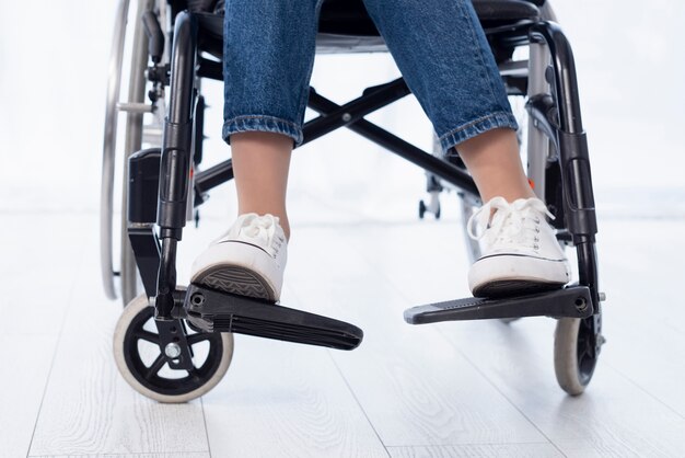 Close-up person in modern wheelchair