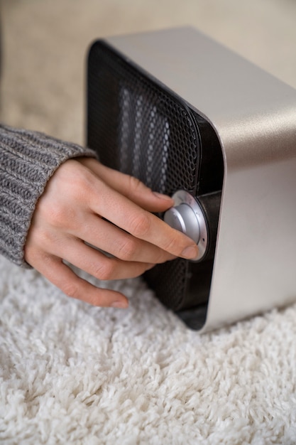 Close up on person near heater