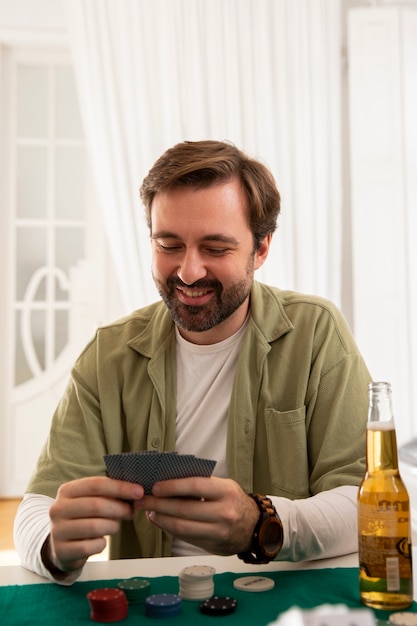 Free photo close up on person playing poker with friends