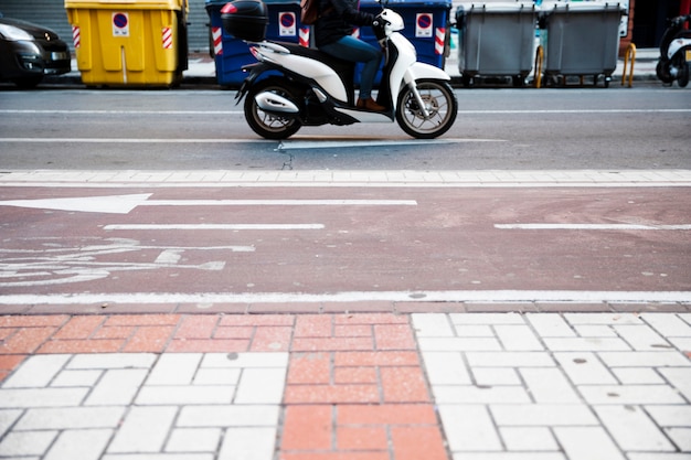 Free photo close-up of a person riding the bike on road