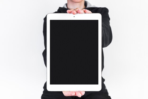 Close-up of a person's hand with large digital tablet