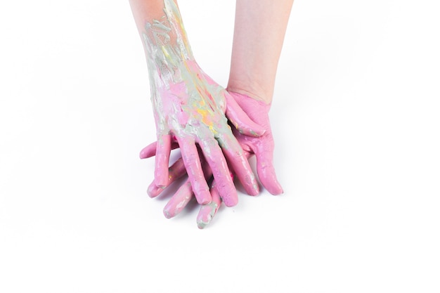 Close-up of a person's messy hands with paint