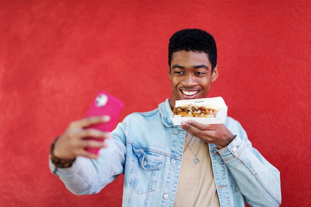 Free photo close up on person taking photo of food