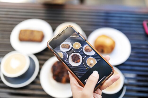 Close up on person taking photo of food