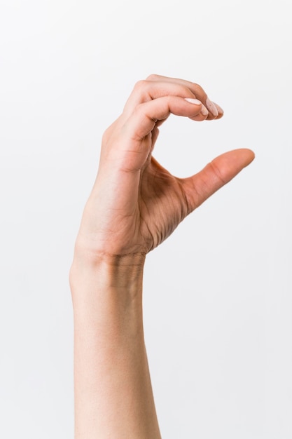 Close-up person teaching sign language