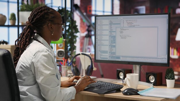 Close up of person using coding application to write and test code