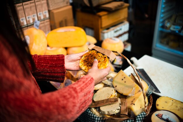 Close-up person with cheese arrangement