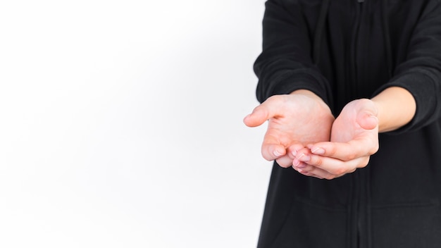 Close-up of a person with cupped hands