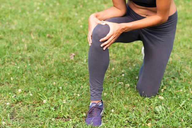 Close-up person with knee ache 