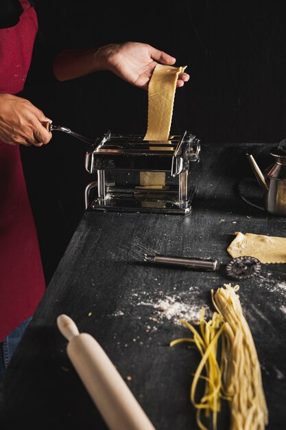 Close-up person with pastry machine 