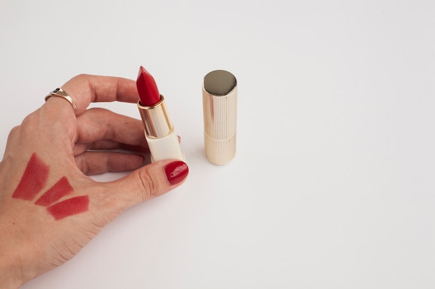 Free photo close-up person with red lipstick and nails