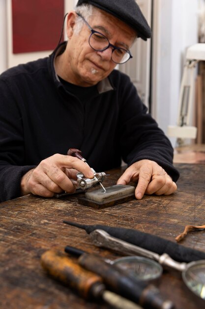 Close up on person working on engraving