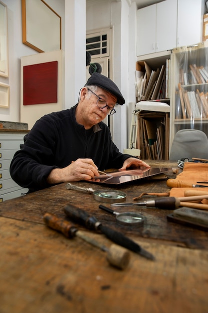 Close up on person working on engraving