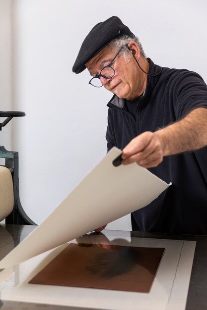 Close up on person working on engraving