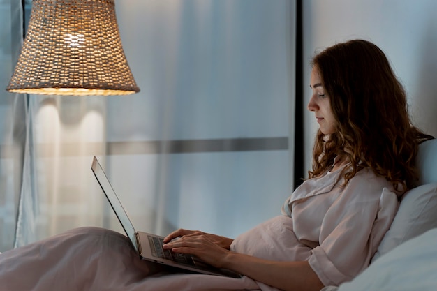 Free photo close up on person working at home at night