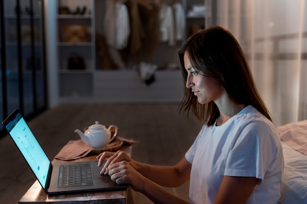 Free photo close up on person working at home at night