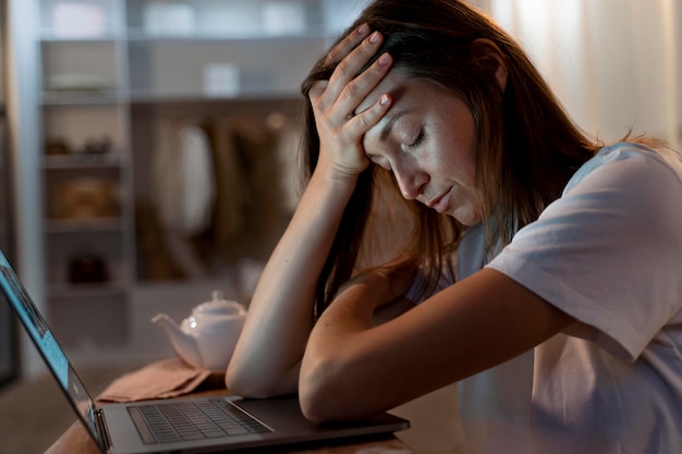 Close up on person working at home at night