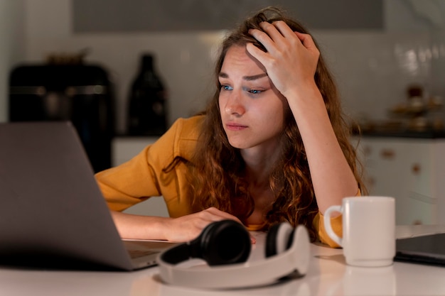 Close up on person working at home at night