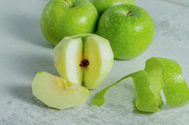 Close up photo of fresh green apple. Whole or peeled. 