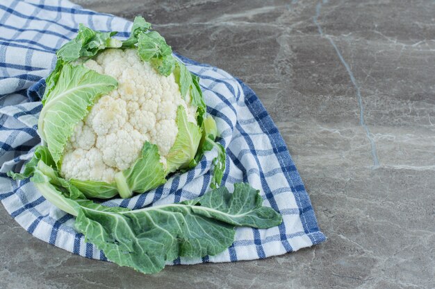 Close up photo Fresh organic cauliflower on grey.