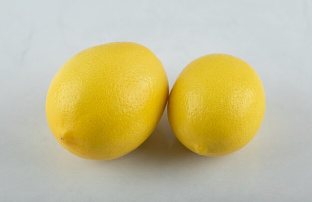Close up photo Fresh ripe lemons on white background.