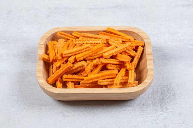 Close up photo of fries in wooden bowl