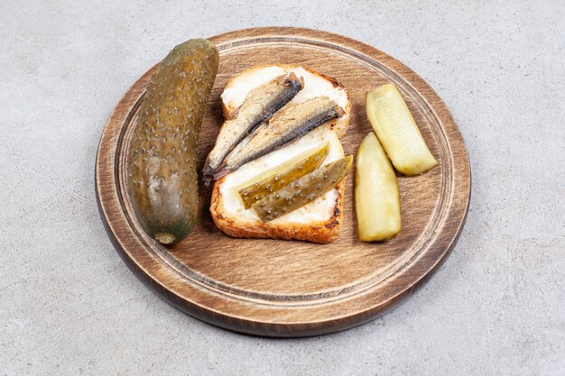 Close up photo of homemade fish sandwich with pickle 