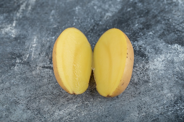 Close up photo of organic Half cut potato. High quality photo