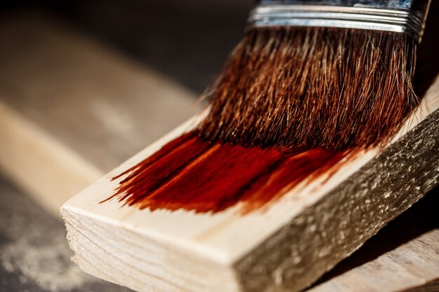 Close up photo of painting wood in brown color.