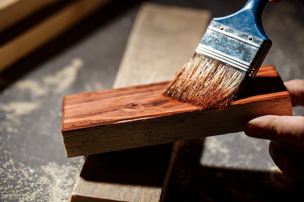 Close up photo of painting wood in brown color.