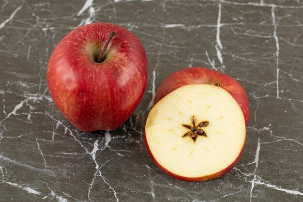 Close up photo of red apple. whole and sliced .